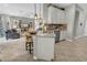 Kitchen island with bar seating, granite counters and pendant lighting at 2918 130Th E Ave, Parrish, FL 34219