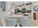 Modern kitchen island with granite countertop and stylish pendant lighting at 2918 130Th E Ave, Parrish, FL 34219