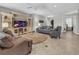 Comfortable living room with tile floors, neutral tones, and bright, airy ambiance at 2918 130Th E Ave, Parrish, FL 34219
