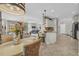 Open concept living, dining and kitchen layout with tile floors and neutral colors at 2918 130Th E Ave, Parrish, FL 34219