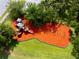 Aerial view of a well maintained playground with slides and swings nestled in a green area at 2918 130Th E Ave, Parrish, FL 34219
