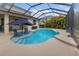 Inviting screened-in pool with sun shelf and relaxing lounge area at 2918 130Th E Ave, Parrish, FL 34219
