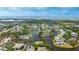 Aerial view of a waterfront community with winding waterways, lush landscaping, and scenic surroundings at 304 108Th W St, Bradenton, FL 34209
