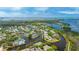 Scenic aerial view of a waterfront community featuring lush landscaping and tranquil waterways for a serene living environment at 304 108Th W St, Bradenton, FL 34209