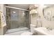 Clean bathroom features a shower with sliding glass doors, a modern vanity, and towel racks at 304 108Th W St, Bradenton, FL 34209