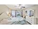 Bright bedroom features a sliding glass door to the outside patio and tile flooring at 304 108Th W St, Bradenton, FL 34209