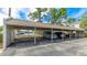 Covered carport with two parking spaces with water view and other covered parking at 304 108Th W St, Bradenton, FL 34209