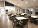 Inviting clubhouse with tables and chairs, perfect for social gatherings and events at 304 108Th W St, Bradenton, FL 34209