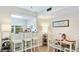 Bright dining area with bar stool seating and a view into the kitchen at 304 108Th W St, Bradenton, FL 34209