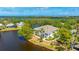 Waterfront condo featuring a private patio and lush landscaping with scenic water views at 304 108Th W St, Bradenton, FL 34209