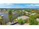 Waterfront property featuring lush landscaping and partial views of the surrounding water and neighborhood at 304 108Th W St, Bradenton, FL 34209