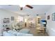 Open living room with updated flooring, neutral colors, and dining area off of the kitchen at 304 108Th W St, Bradenton, FL 34209