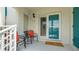 Cozy outdoor patio with chairs and a welcome mat, unit number 304 at 304 108Th W St, Bradenton, FL 34209