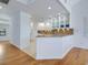 Bright and airy kitchen with modern cabinets, granite countertops, and a seamless flow into the dining space at 3201 Casey Key Rd, Nokomis, FL 34275