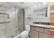 Modern bathroom with glass enclosed tile shower, and updated vanity at 3204 Lake Bayshore Dr # 407, Bradenton, FL 34205