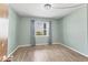 Bedroom featuring light-green walls and hardwood floors and great natural light at 3204 Lake Bayshore Dr # 407, Bradenton, FL 34205