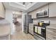 Kitchen showcasing stainless steel appliances and an eat-in area, creating a welcoming space at 3204 Lake Bayshore Dr # 407, Bradenton, FL 34205