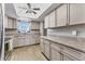 Bright kitchen with neutral countertops, ample cabinets, and stainless steel appliances at 3204 Lake Bayshore Dr # 407, Bradenton, FL 34205