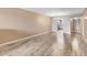 Spacious living room featuring modern wood flooring and neutral wall color at 3204 Lake Bayshore Dr # 407, Bradenton, FL 34205