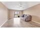 A well-lit living room with cozy seating and a sliding door to a balcony at 3204 Lake Bayshore Dr # 407, Bradenton, FL 34205