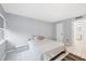 Bright bedroom featuring a queen-size bed, neutral walls, tile floors, a window, and a closet at 3251 Beneva Rd # 104, Sarasota, FL 34232