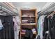 Walk-in closet featuring shelves, hanging rods, and ample storage for clothes and accessories at 3251 Beneva Rd # 104, Sarasota, FL 34232