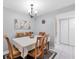 Dining room features neutral walls, elegant chandelier, seating for six, and decor that creates a welcoming space at 3251 Beneva Rd # 104, Sarasota, FL 34232