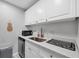 Cozy kitchen with stainless steel appliances and white cabinetry, complemented by stylish countertop and modern fixtures at 3251 Beneva Rd # 104, Sarasota, FL 34232