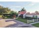 Well-kept property with assigned parking, showing the manicured lawn and mature landscaping at 3251 Beneva Rd # 104, Sarasota, FL 34232