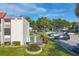 Scenic view of shuffleboard courts with benches and lush landscaping in a well-maintained community at 3251 Beneva Rd # 104, Sarasota, FL 34232