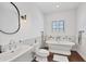 Charming bathroom with soaking tub, sink with vanity, and stylish fixtures at 3432 Founders Club Dr, Sarasota, FL 34240