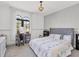 Light-filled bedroom showcasing plush bed, arched windows, and contemporary decor at 3432 Founders Club Dr, Sarasota, FL 34240