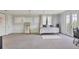 Large bedroom featuring neutral carpet and French door access to a private balcony at 3432 Founders Club Dr, Sarasota, FL 34240