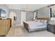 Cozy bedroom with neutral color palette, with a decorative rug and ample closet space at 3432 Founders Club Dr, Sarasota, FL 34240