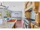Kitchen featuring granite counters, island seating, and stainless steel range at 3432 Founders Club Dr, Sarasota, FL 34240