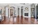 Spacious living room with fireplace, hardwood floors, and detailed trim at 3432 Founders Club Dr, Sarasota, FL 34240