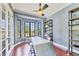 Stylish home office featuring custom metal table, and large windows offering natural light at 3432 Founders Club Dr, Sarasota, FL 34240