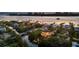 Beautiful neighborhood with manicured lawns, waterfront access, and an illuminated residence near the ocean at 3465 Gulfmead Dr, Sarasota, FL 34242