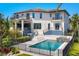 Expansive backyard with a pool, spa, patio, and wrought iron fence at 3465 Gulfmead Dr, Sarasota, FL 34242