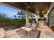 Outdoor kitchen on balcony featuring built-in grill, bar seating, and panoramic views at 3465 Gulfmead Dr, Sarasota, FL 34242