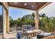 Spacious balcony with outdoor seating and railing overlooking lush tropical foliage at 3465 Gulfmead Dr, Sarasota, FL 34242