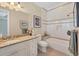 Bright bathroom with granite counters and integrated tub at 3465 Gulfmead Dr, Sarasota, FL 34242