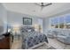 Comfortable bedroom features two upholstered armchairs near a window for a relaxing sitting area at 3465 Gulfmead Dr, Sarasota, FL 34242