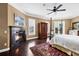 Sunlit bedroom with fireplace, canopy bed, and balcony access; a serene retreat at 3465 Gulfmead Dr, Sarasota, FL 34242