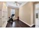 Exercise room features a stationary bike, hardwood floors, and a built-in bookcase at 3465 Gulfmead Dr, Sarasota, FL 34242