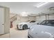 Spacious garage with multiple cars and access to an interior staircase at 3465 Gulfmead Dr, Sarasota, FL 34242