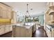 Spacious kitchen with granite counters, an island, and stainless steel appliances at 3465 Gulfmead Dr, Sarasota, FL 34242