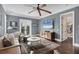 Comfortable living room with stylish furnishings, TV, and access to the balcony at 3465 Gulfmead Dr, Sarasota, FL 34242