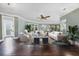 Spacious living room featuring hardwood floors, elegant furniture, and plenty of natural light at 3465 Gulfmead Dr, Sarasota, FL 34242