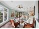 Sunlit living room featuring dark hardwood floors and a view of the outdoors at 3465 Gulfmead Dr, Sarasota, FL 34242